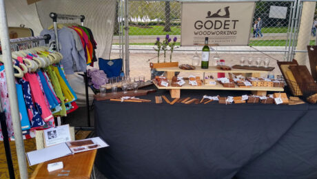 Godet Woodworking booth at a craft fair