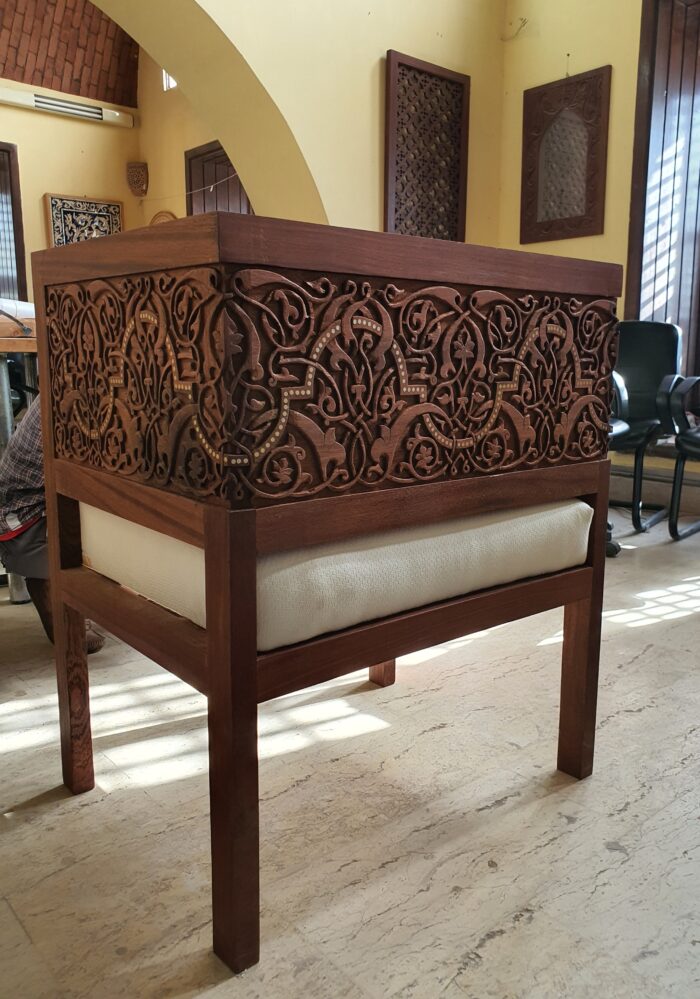 A hand-carved chair with a floral design by Mirna ElTatawy.