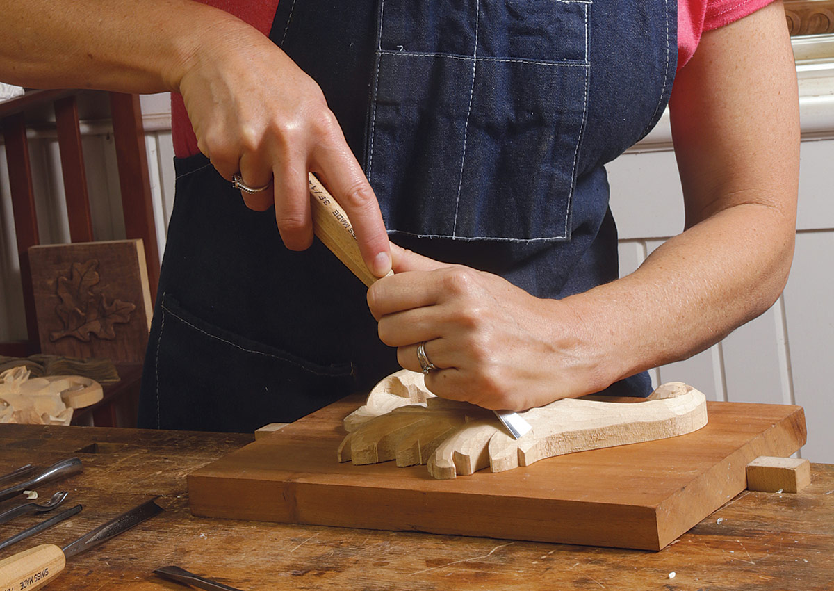 using both hands to carve safely