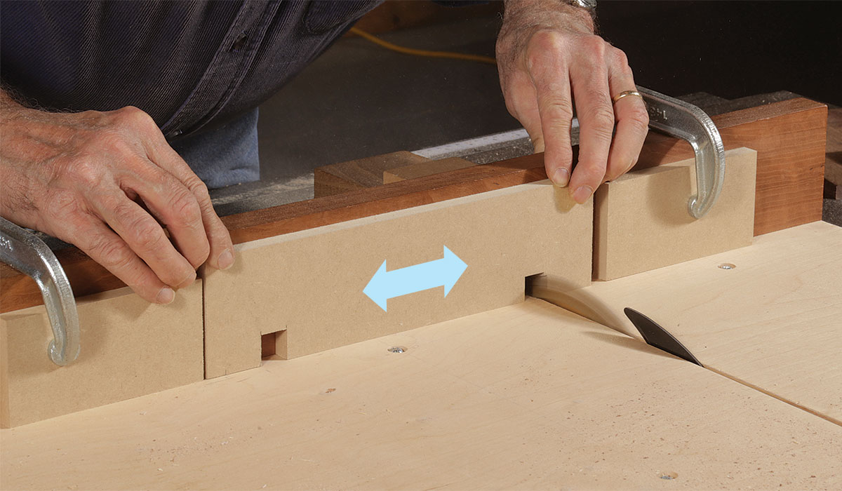 Clamping a pair of stops to a sled to notch the jig base
