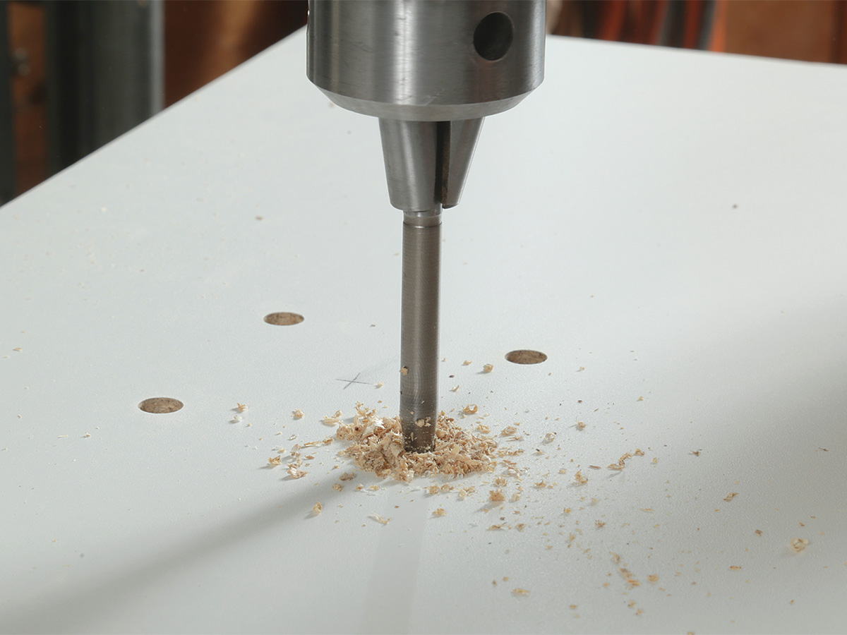 drilling holes for mounting screws on router table