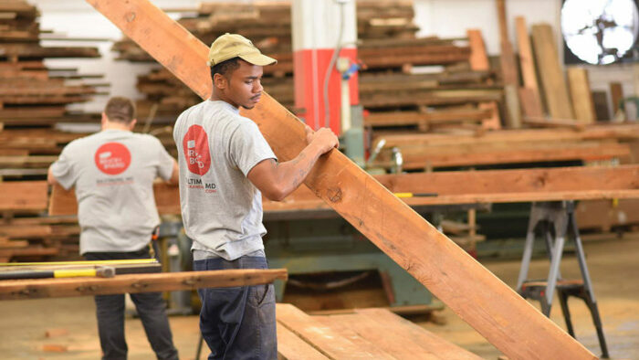 Brick + Board employees salvage urban lumber in their facility
