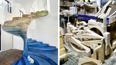 On the left, a sprawling, modern spiral staircase made from ash and stained with a blue gradient at Ottra by Zimmerman, Workshop Showroom in Red Hook, Brooklyn. On the right, a pile of scrap pieces of wood.