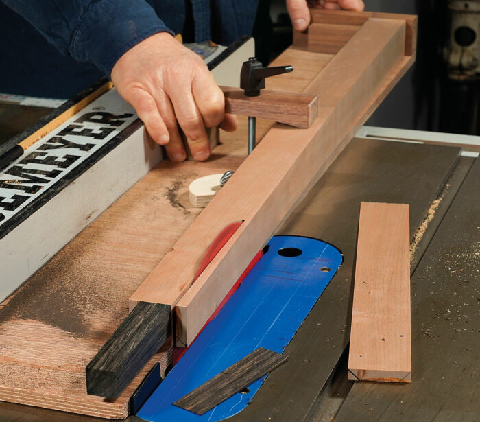 Taper the leg and foot. Use a sled-type jig and remember to reposition the stops after the second taper is cut.
