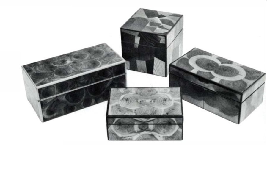 A black and white photo of four boxes with end grain veneer oriented in various patterns. 