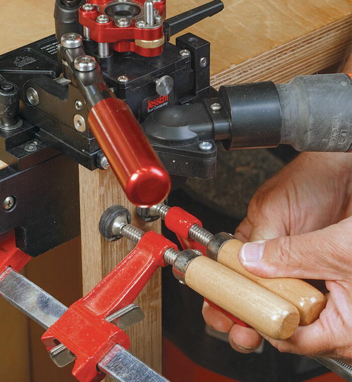 Clamping can be tricky with the basic jig. The jig can be screwed to a benchtop as shown, which makes clamping a bit tricky, or held in a vise with room below it for pieces to extend downward.