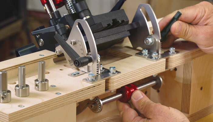Smart features. The workstation’s baseplate rotates for angled joinery, and there are storage holes for all six cutters.