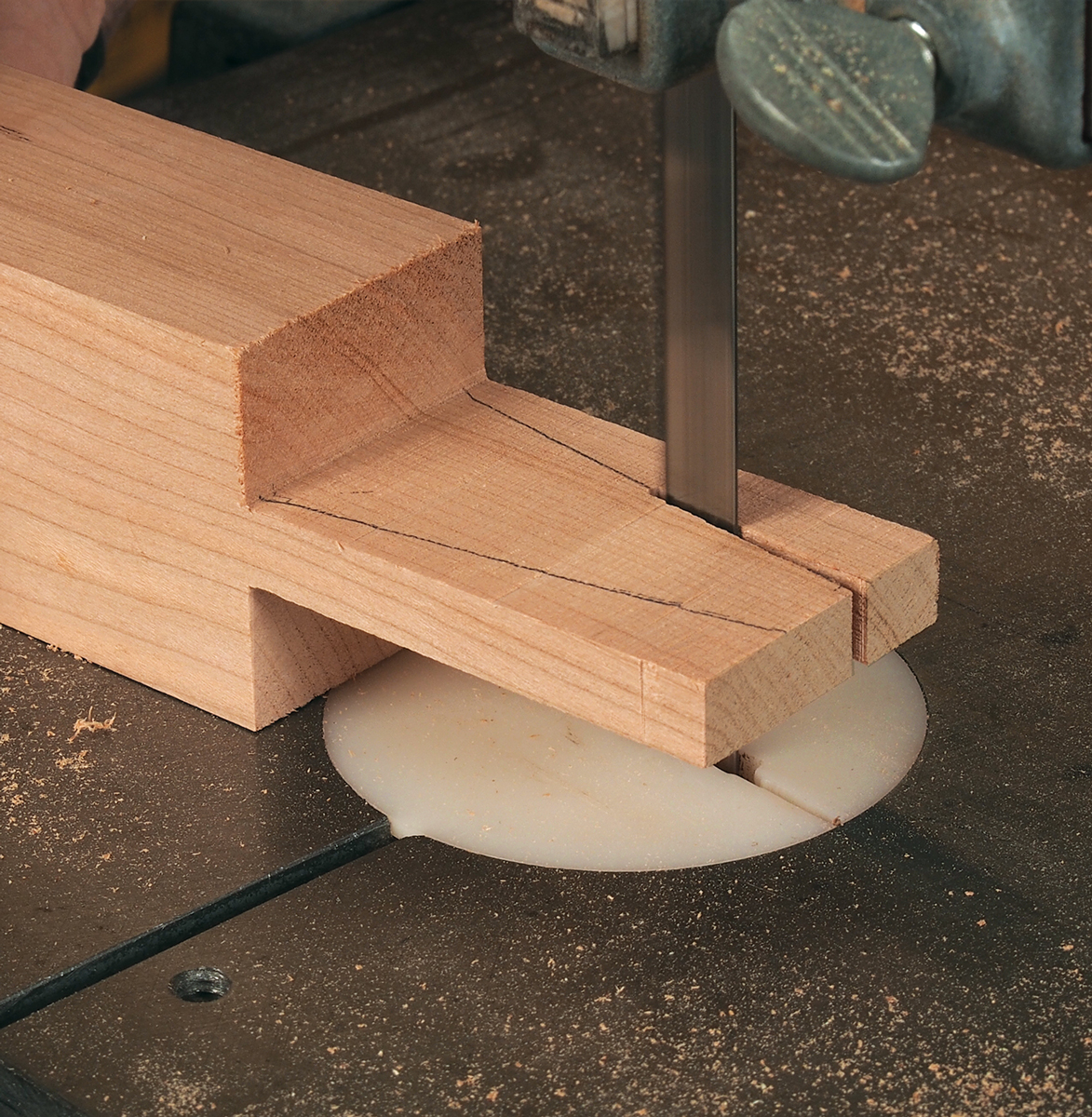 While the stock is still long, pencil in your angle lines, and then cut them freehand on the bandsaw.