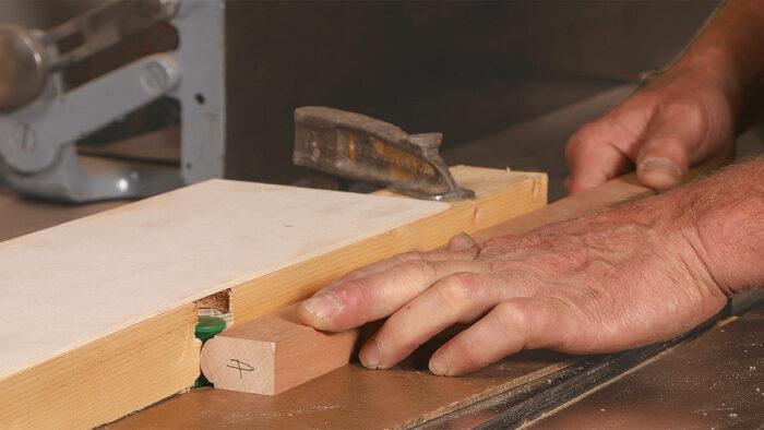 Cameron cuts the molding profile on the router table with a half-radius bullnose bit, then a thumbnail beading bit