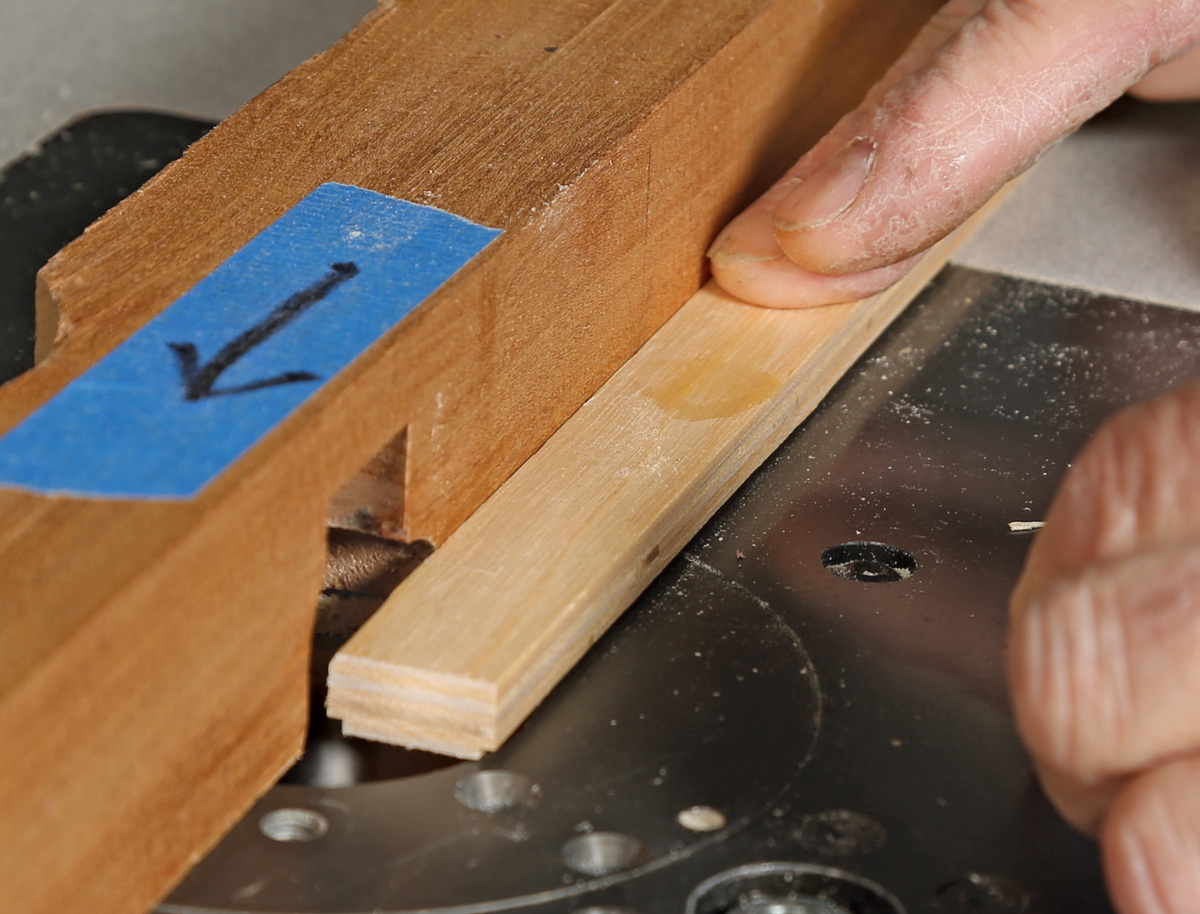 Mill the runners. After ripping strips of plywood to near final width, run them on edge through the planer to get them to exact size. Cut a small rabbet along the edges of the face that will meet the bottom of the sled, and gently round over the edges of the other face.