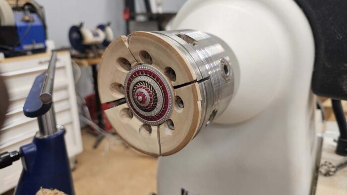 A beautiful top sits finished mounted in the soft-jaw chuck. It's an enticing array of patterns and colors.
