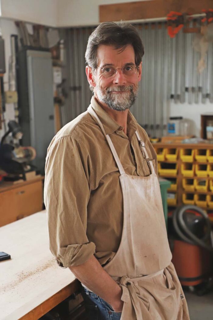 A portrait of Tom in his shop.
