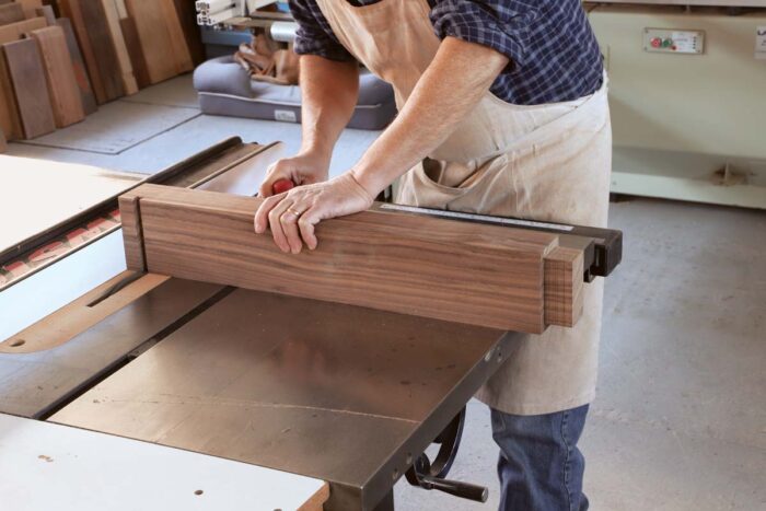 Tom cuts the shoulders of a tenon at the tablesaw.