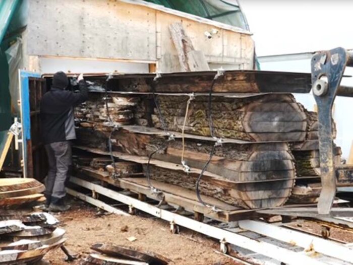 Wood being loaded into a kiln.