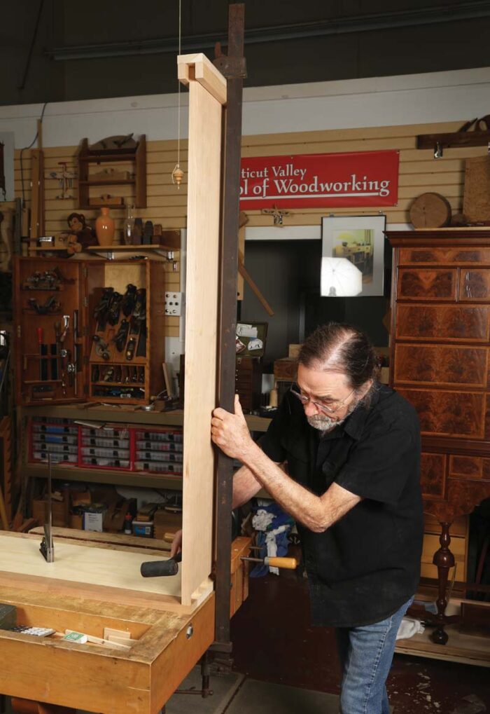 BoB Van Dyke clamps a tail board vertically to transfer the scribe lines.