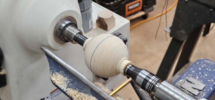 A sphere forming on the lathe