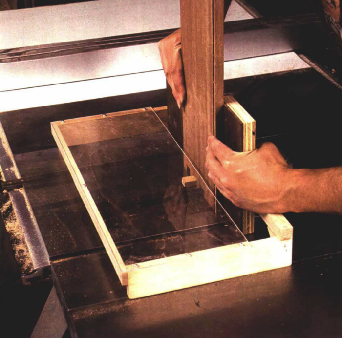 A box joint jig with plexiglass over the top, which allows you to see your cut and protect your hands.